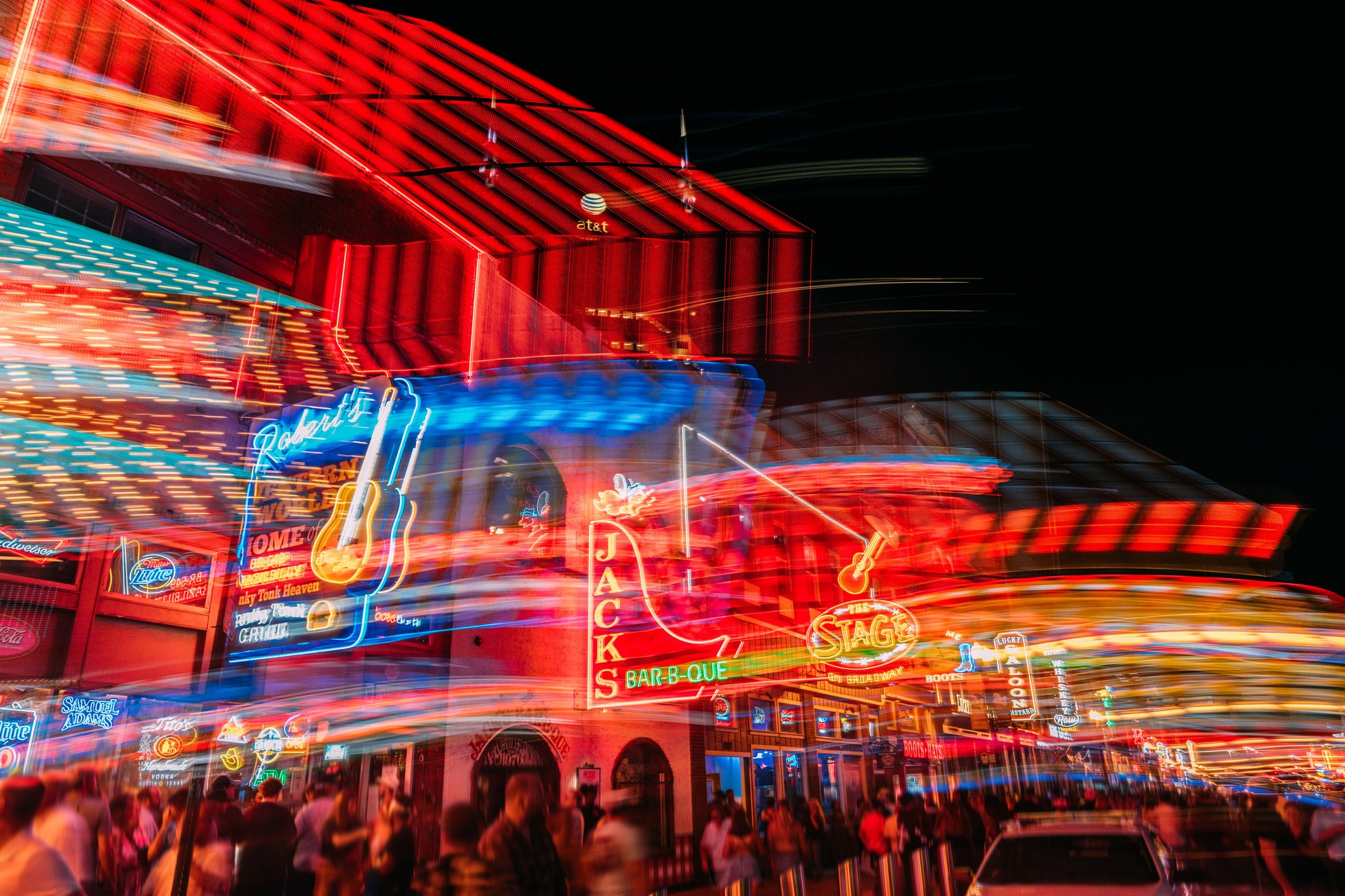 Artistic Long Shutter of Neon Signs on Broadway, the Tourism Center of Downtown Nashville, Tennessee - Representing a Tourist's Drunken Night Out on a Weekend